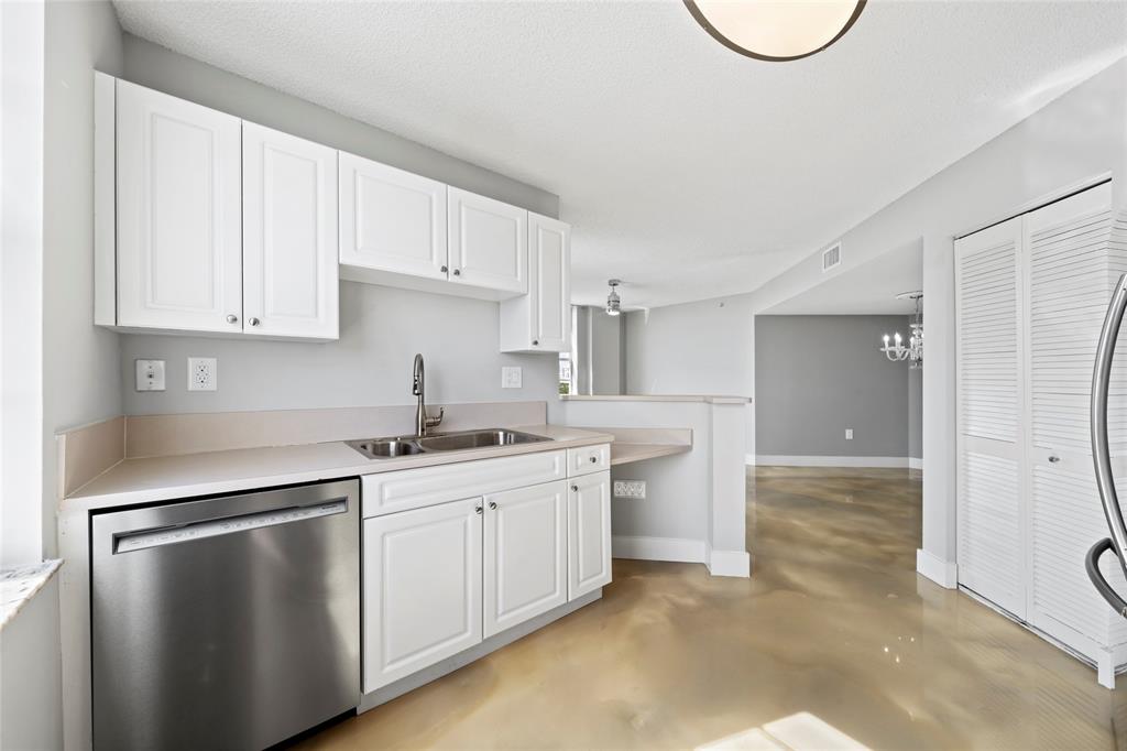 520 Southeast 5th Avenue, Unit 1504 Fort Lauderdale, FL 33301 - Photo 10 of 53 a kitchen with a sink stove and cabinets