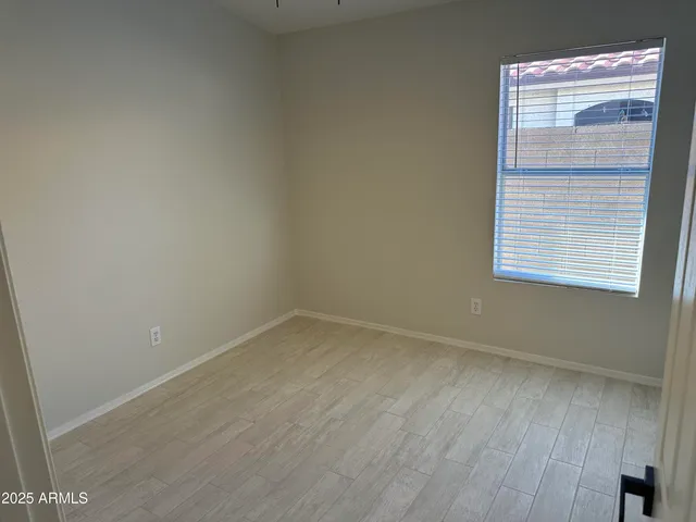 a view of empty room with windows