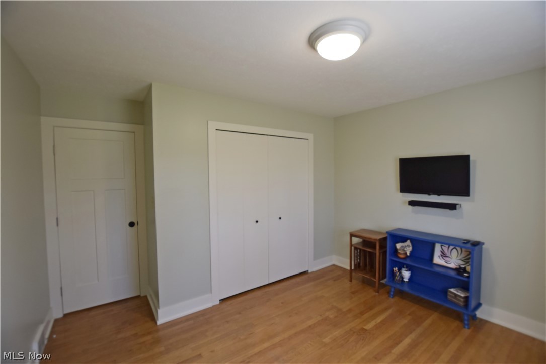 6770 Akron Peninsula Road Peninsula, OH 44264 - Photo 27 of 35 Bedroom featuring a closet and light wood-type flooring