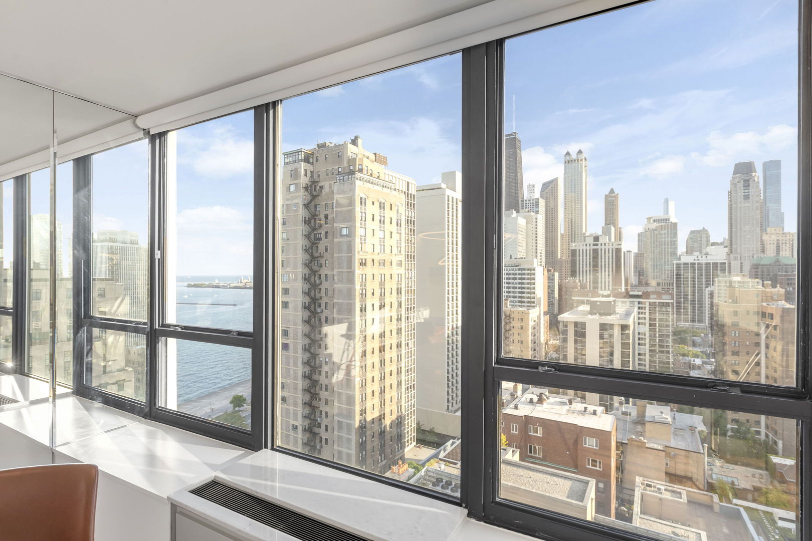 1313 North Ritchie Court, Unit 2401 Chicago, IL 60610 - Photo 12 of 29 a view of a city from a living room