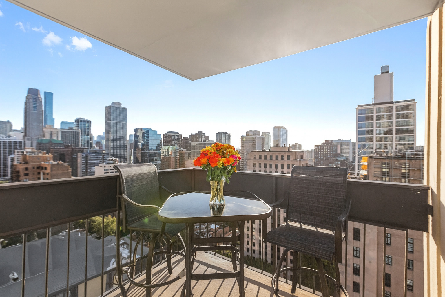 1313 North Ritchie Court, Unit 2401 Chicago, IL 60610 - Photo 13 of 29 a terrace with a table and chairs