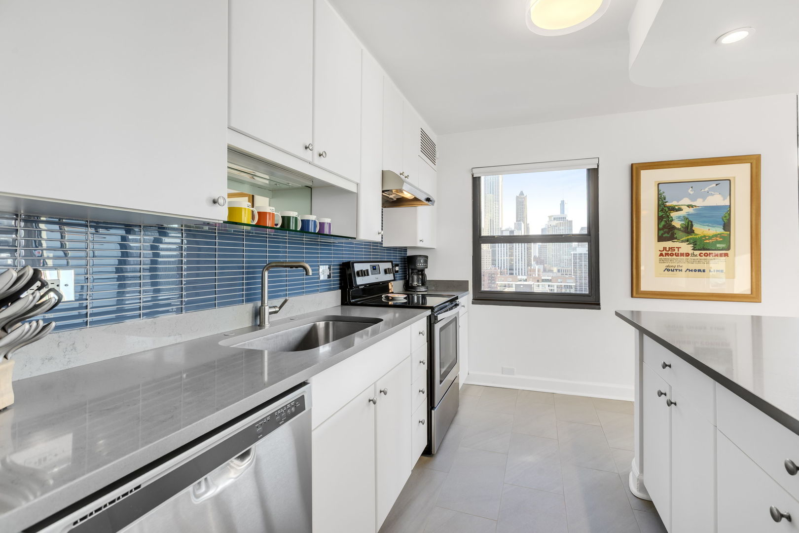 1313 North Ritchie Court, Unit 2401 Chicago, IL 60610 - Photo 17 of 29 a kitchen with stainless steel appliances a sink and a stove
