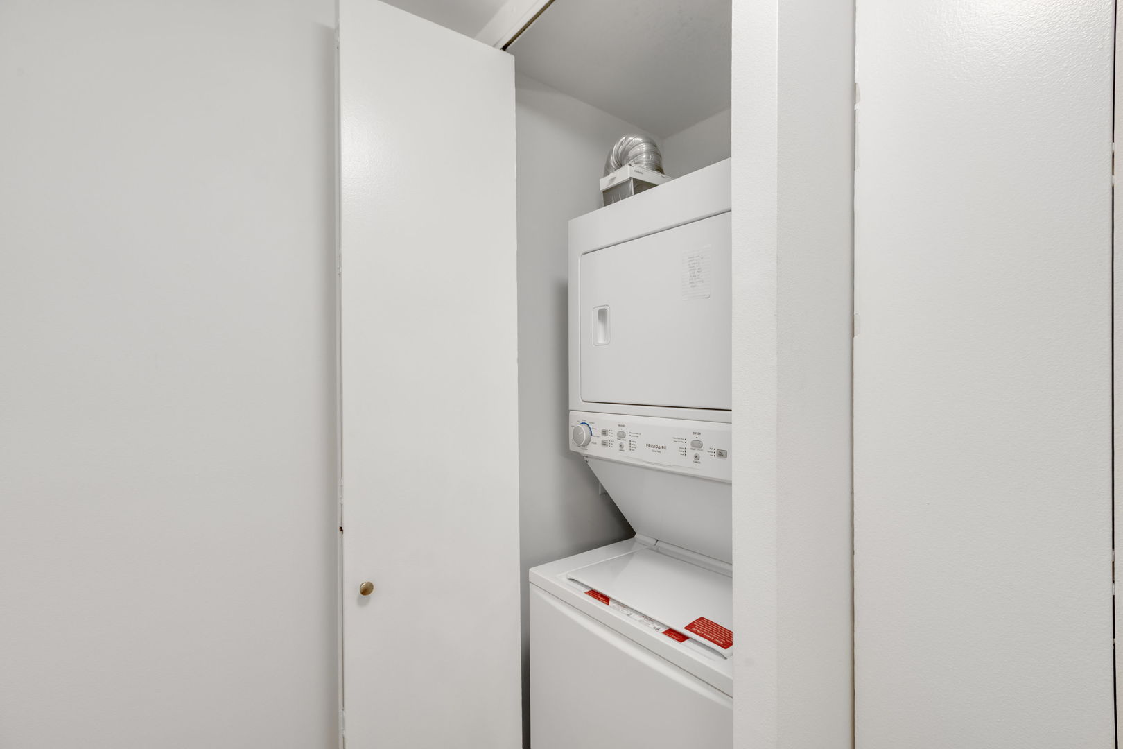 1313 North Ritchie Court, Unit 2401 Chicago, IL 60610 - Photo 24 of 29 a utility room with dryer and washer