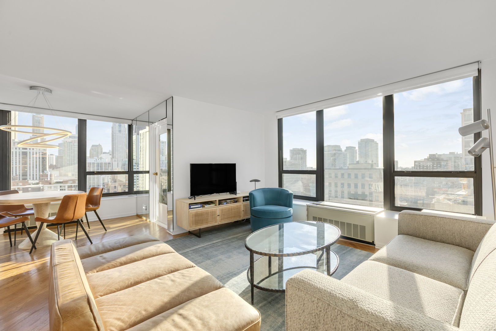 1313 North Ritchie Court, Unit 2401 Chicago, IL 60610 - Photo 6 of 29 a living room with furniture and a flat screen tv