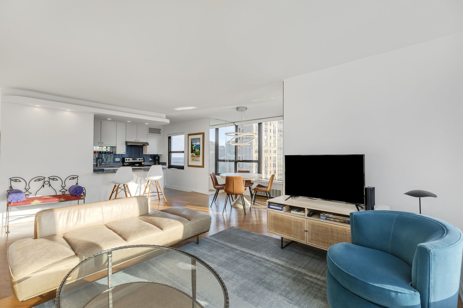 1313 North Ritchie Court, Unit 2401 Chicago, IL 60610 - Photo 8 of 29 a living room with furniture and a flat screen tv