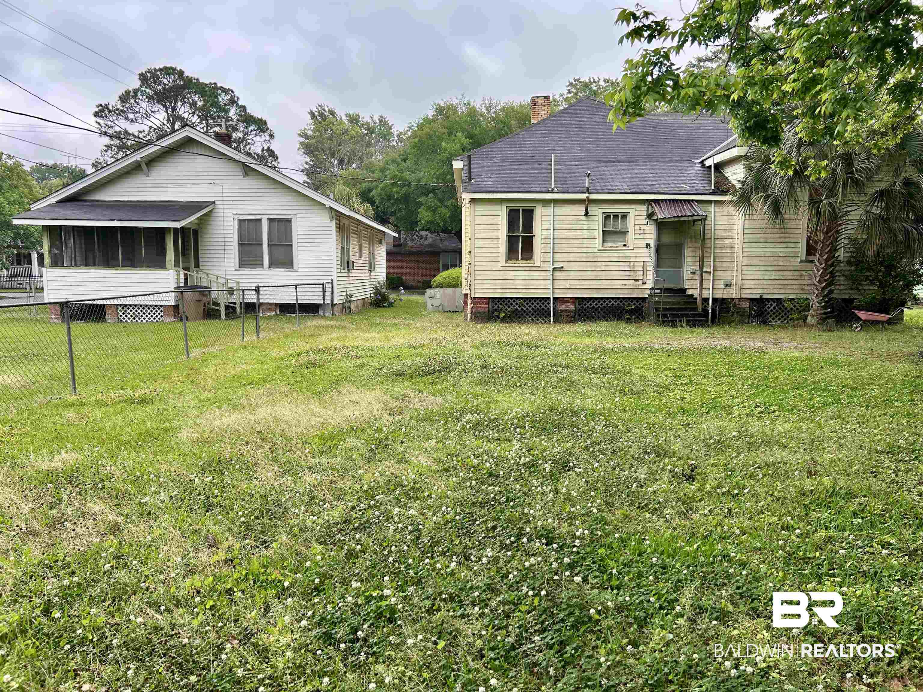 302 Stocking Street Mobile, AL 36604 - Photo 1 of 31 Expansive outdoor space featuring two single-story structures