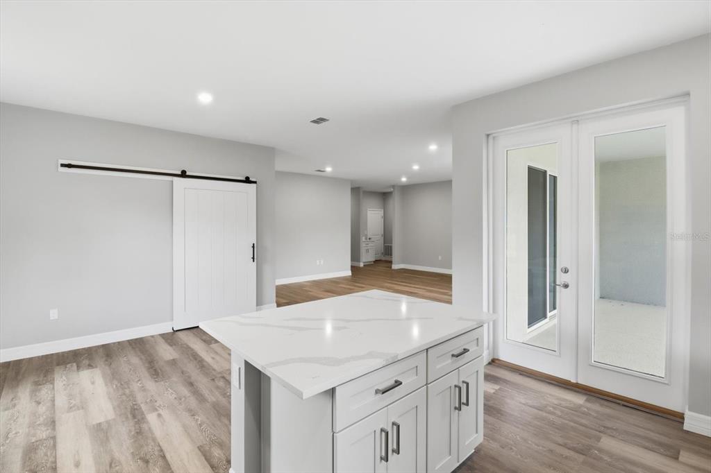 6349 Southwest 134th Loop Ocala, FL 34473 - Photo 16 of 45 a kitchen with a sink and refrigerator