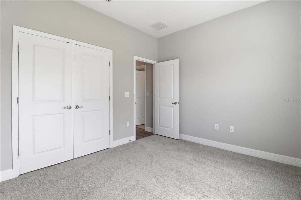 6349 Southwest 134th Loop Ocala, FL 34473 - Photo 31 of 45 an empty room with closet area