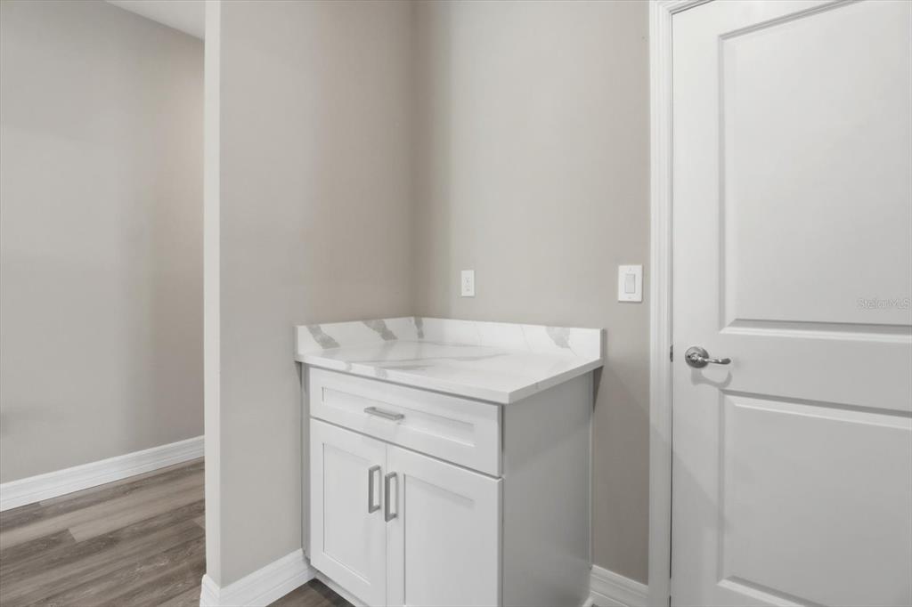 6349 Southwest 134th Loop Ocala, FL 34473 - Photo 35 of 45 a utility room with cabinets washer and dryer