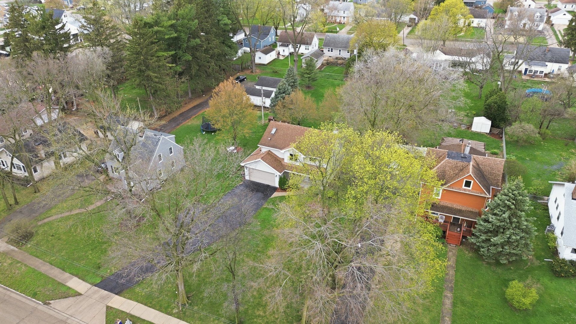 1016 North 7th Street Rochelle, IL 61068 - Photo 28 of 39 an aerial view of residential house with outdoor space and trees all around