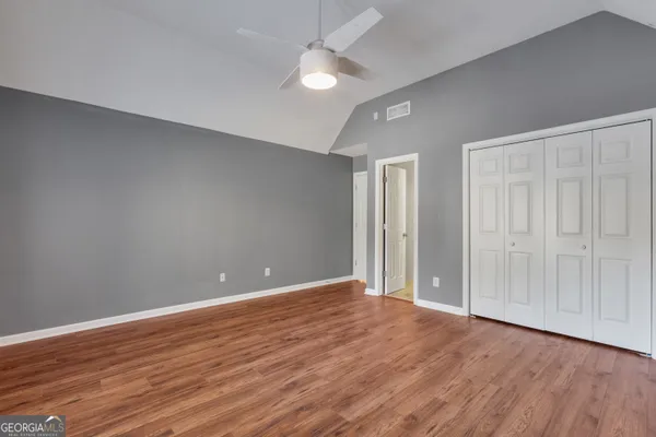 a room with pool table and ceiling fan