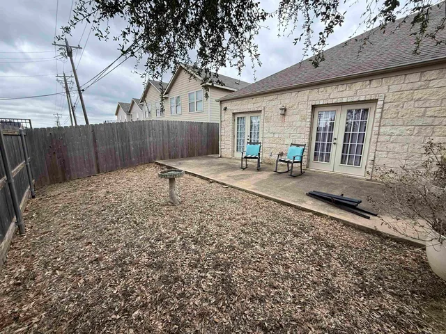 a backyard of a house with seating space