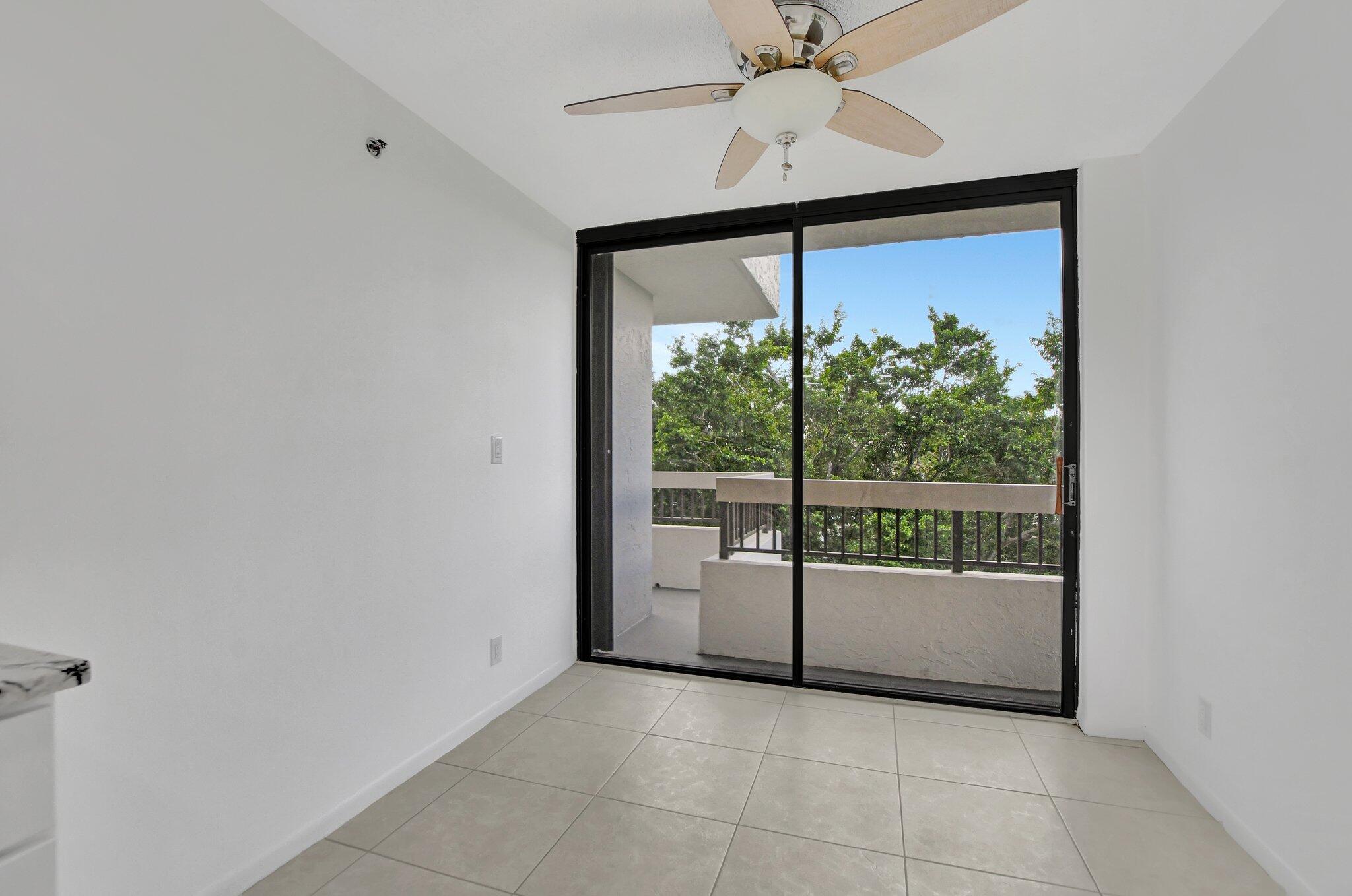 23200 Camino Del Mar, Unit 508 Boca Raton, FL 33433 - Photo 26 of 51 a view of a big room with wooden floor and windows