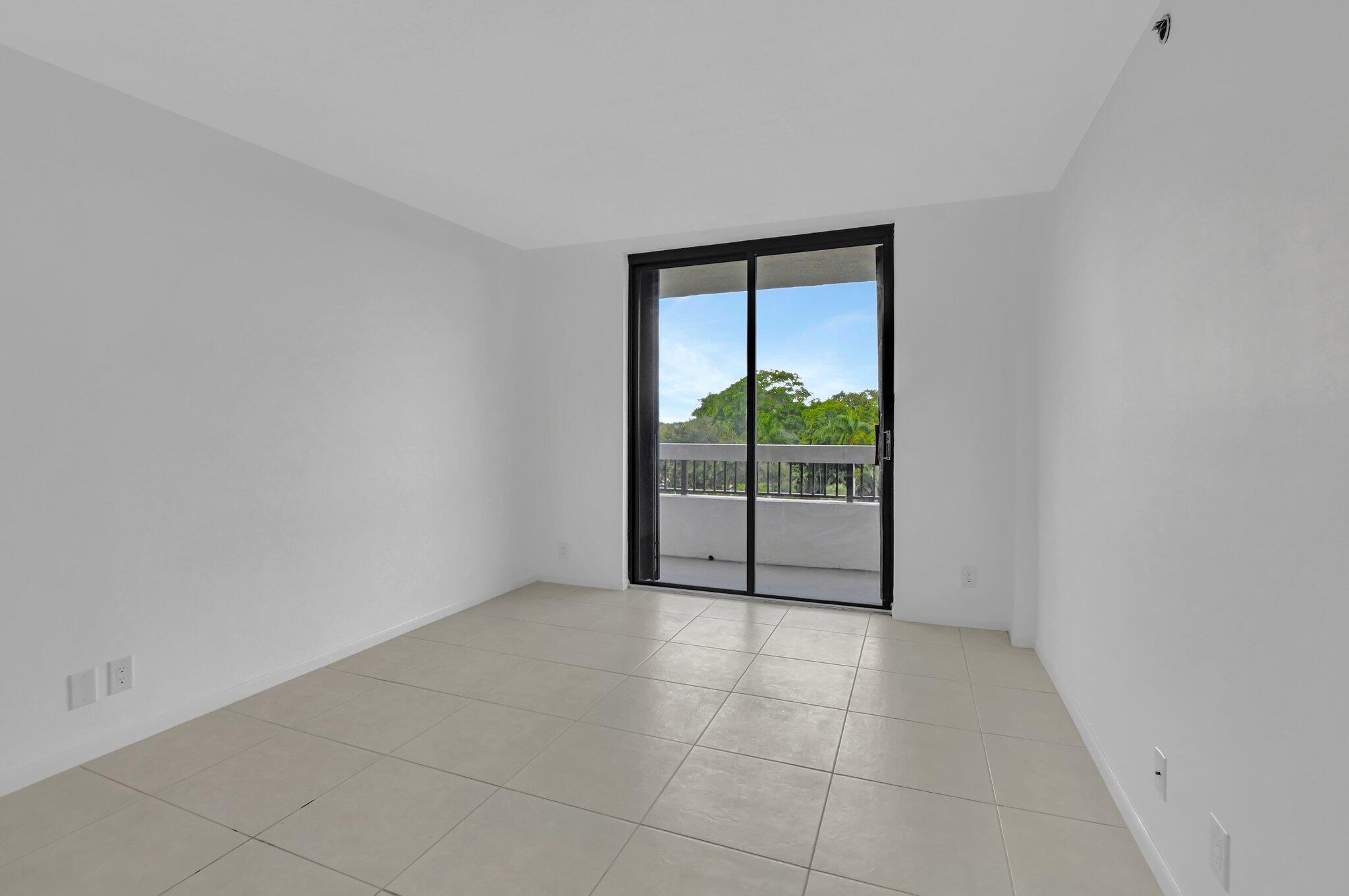 23200 Camino Del Mar, Unit 508 Boca Raton, FL 33433 - Photo 27 of 51 a view of an empty room with windows
