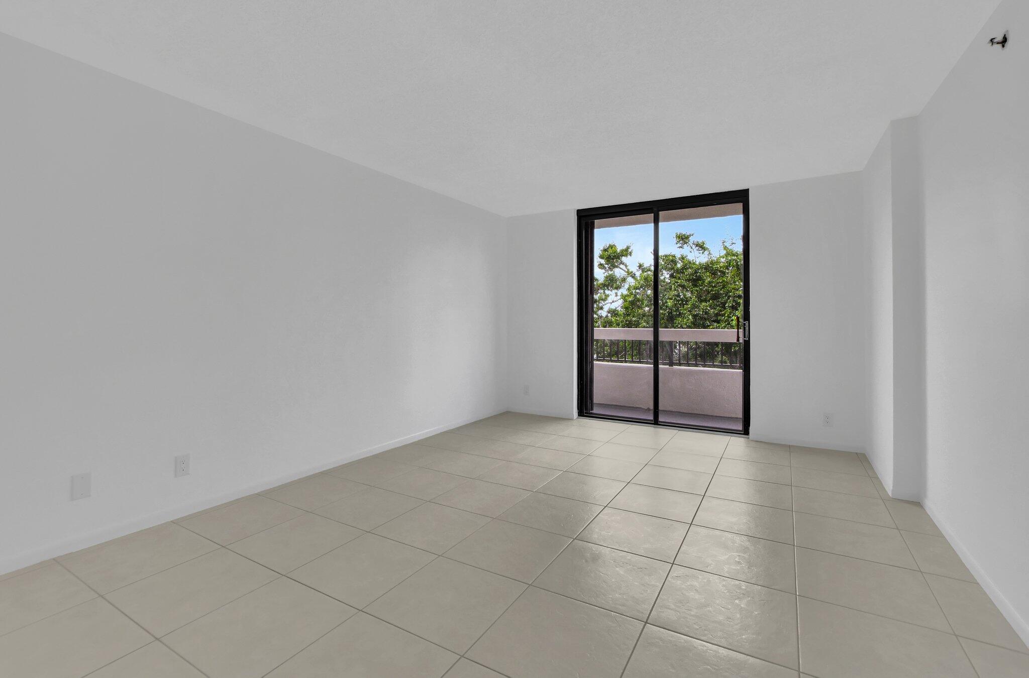 23200 Camino Del Mar, Unit 508 Boca Raton, FL 33433 - Photo 35 of 51 a view of an empty room with a window