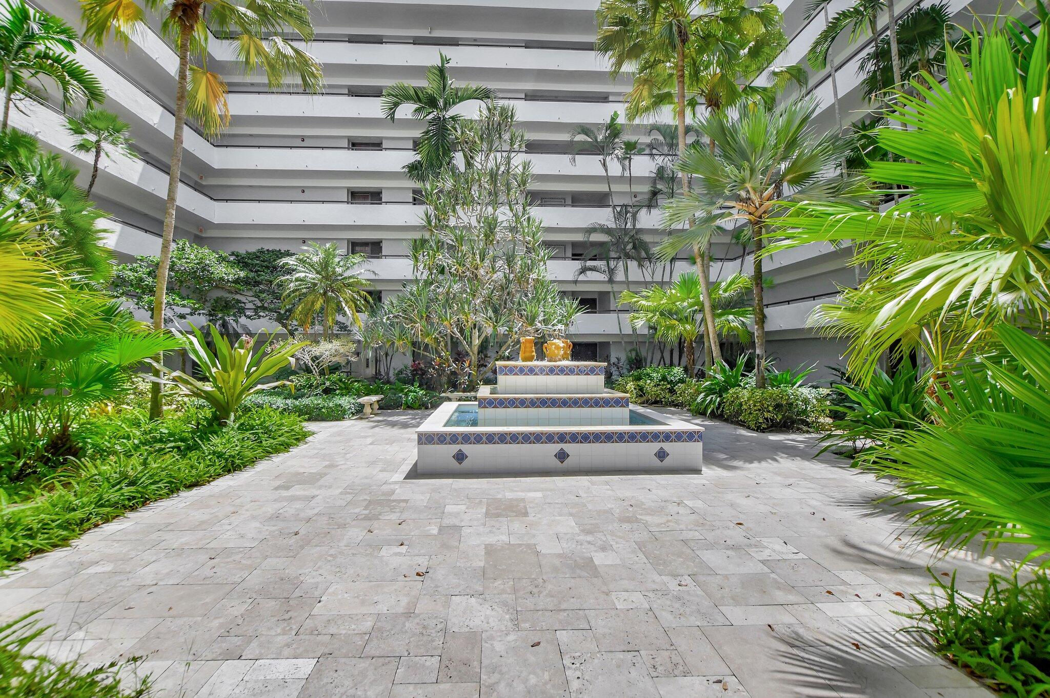 23200 Camino Del Mar, Unit 508 Boca Raton, FL 33433 - Photo 5 of 51 a view of a pathway with flower garden