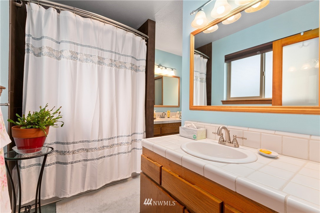 508 Cypress Road Bellingham, WA 98225 - Photo 22 of 40 a bathroom with a sink and a mirror
