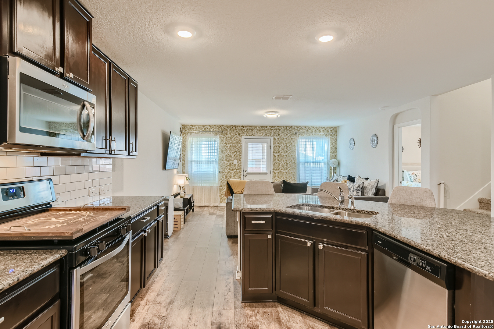 13322 Silky Rye San Antonio, TX 78254 - Photo 11 of 44 a kitchen with a sink stove and cabinets
