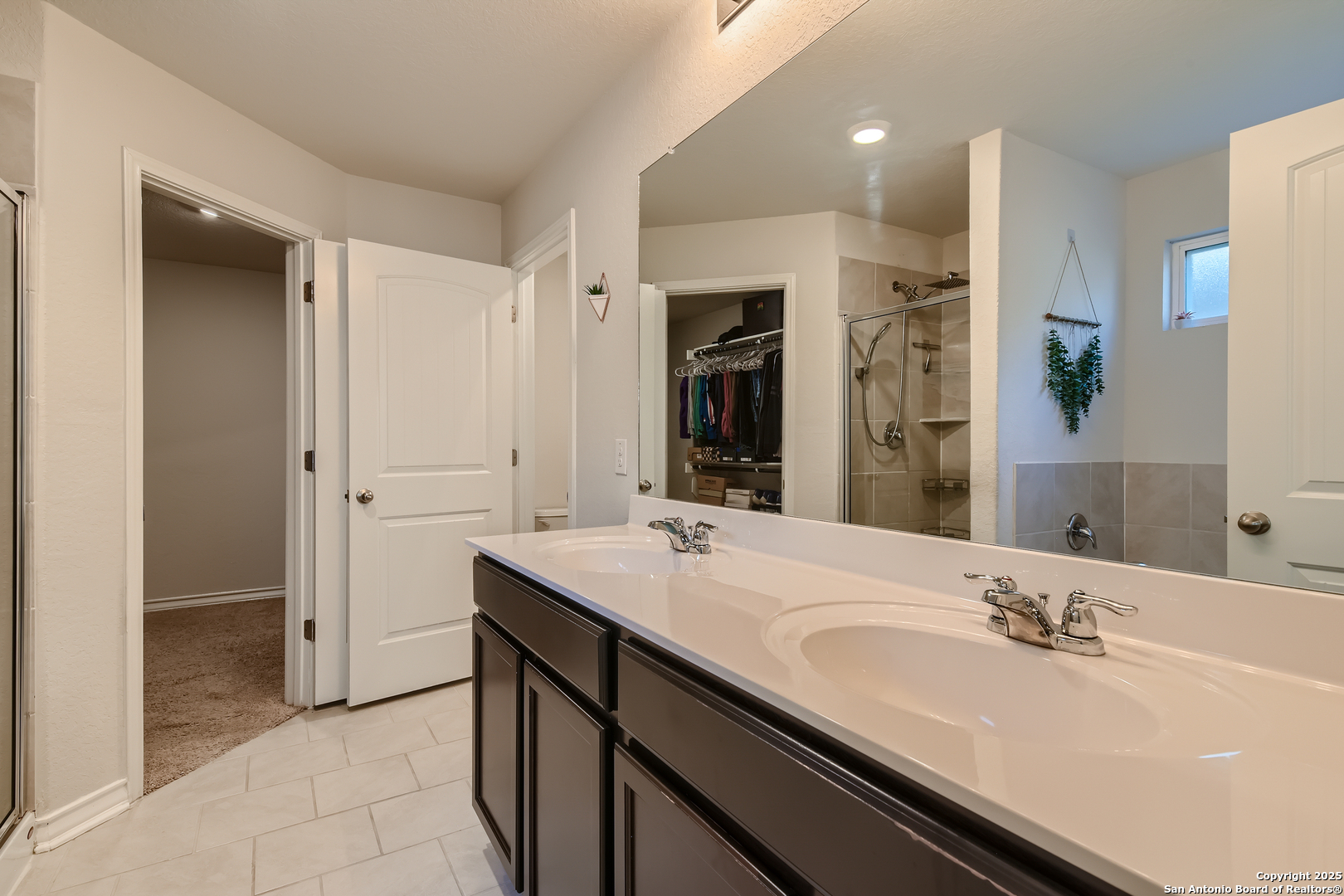 13322 Silky Rye San Antonio, TX 78254 - Photo 16 of 44 a bathroom with a sink and a mirror