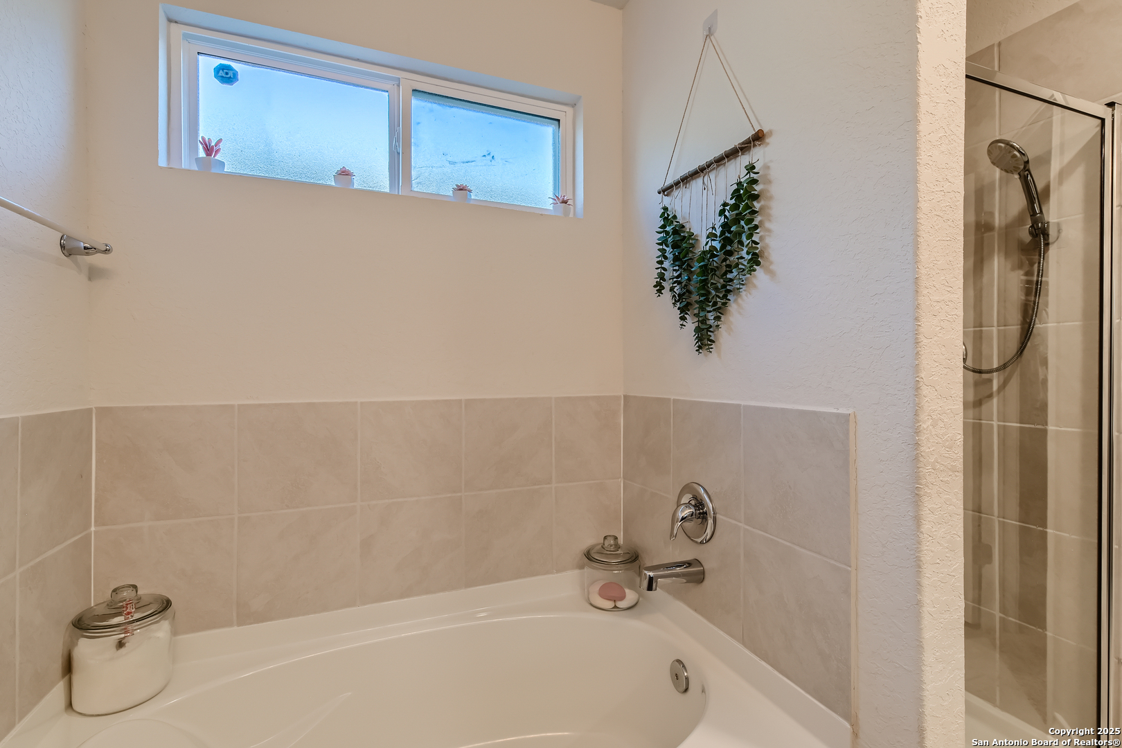 13322 Silky Rye San Antonio, TX 78254 - Photo 17 of 44 a bathroom with a bathtub