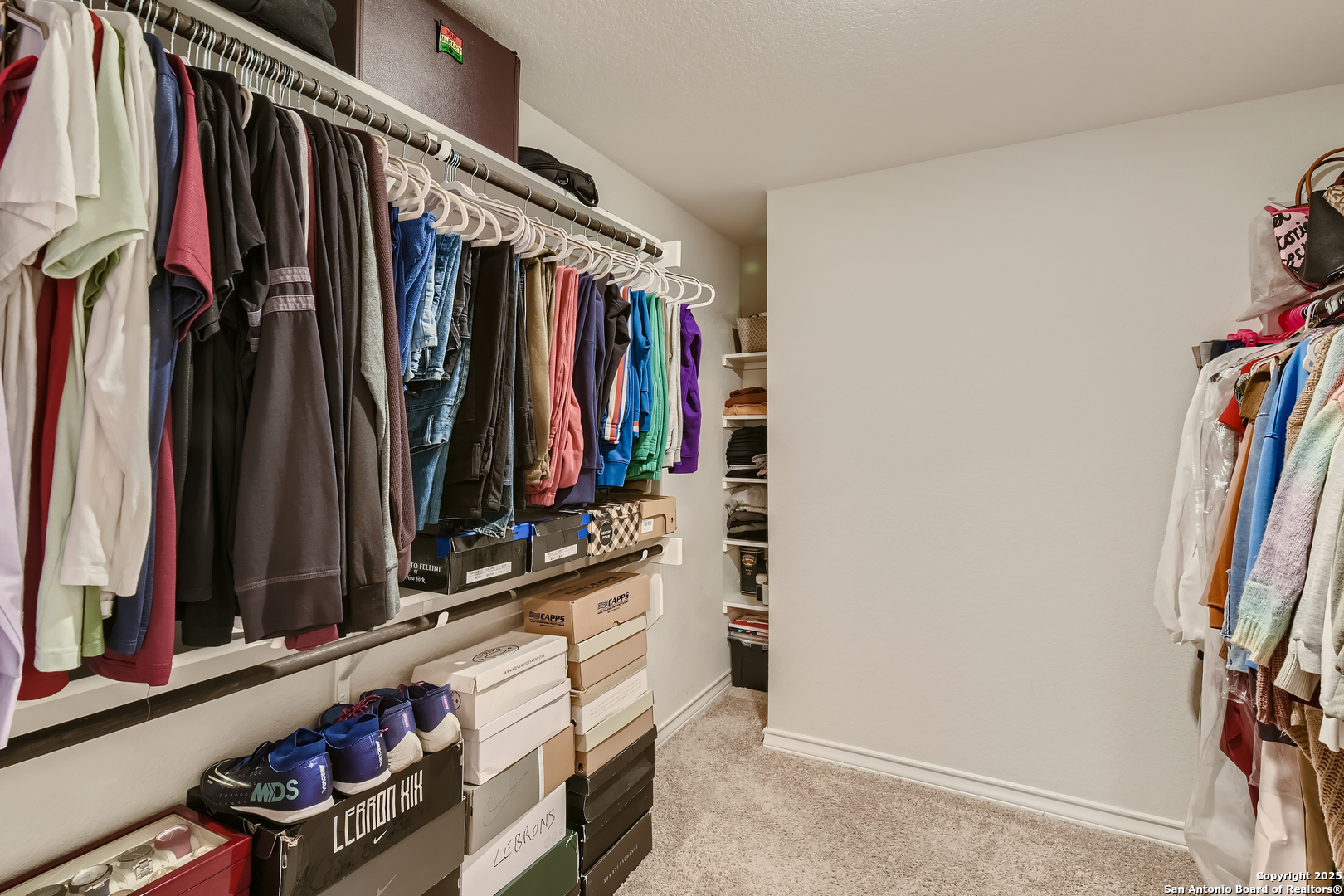 13322 Silky Rye San Antonio, TX 78254 - Photo 18 of 44 a view of walk in closet with clothes and shoes