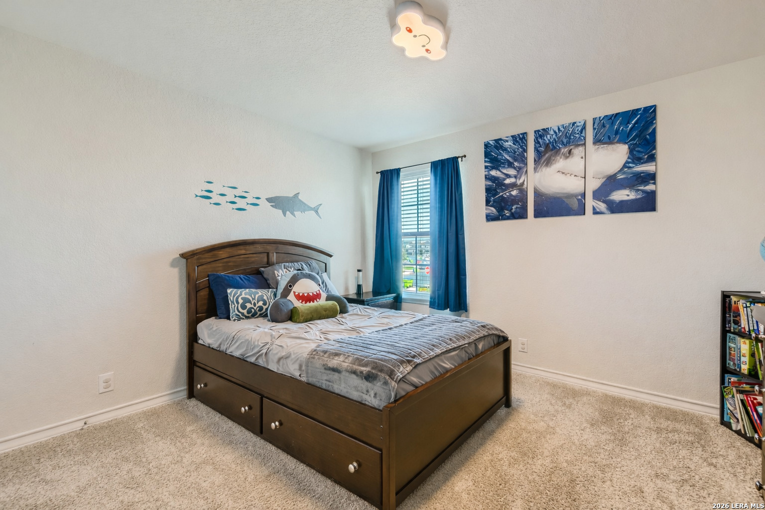 13322 Silky Rye San Antonio, TX 78254 - Photo 21 of 44 a bedroom with a bed and a painting on the wall