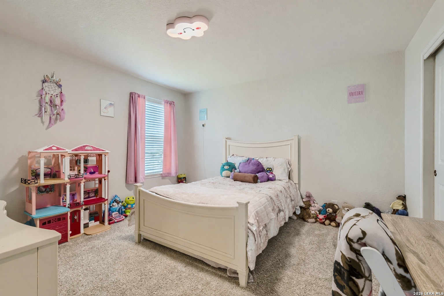 13322 Silky Rye San Antonio, TX 78254 - Photo 23 of 44 a bedroom with a bed and a bookshelf