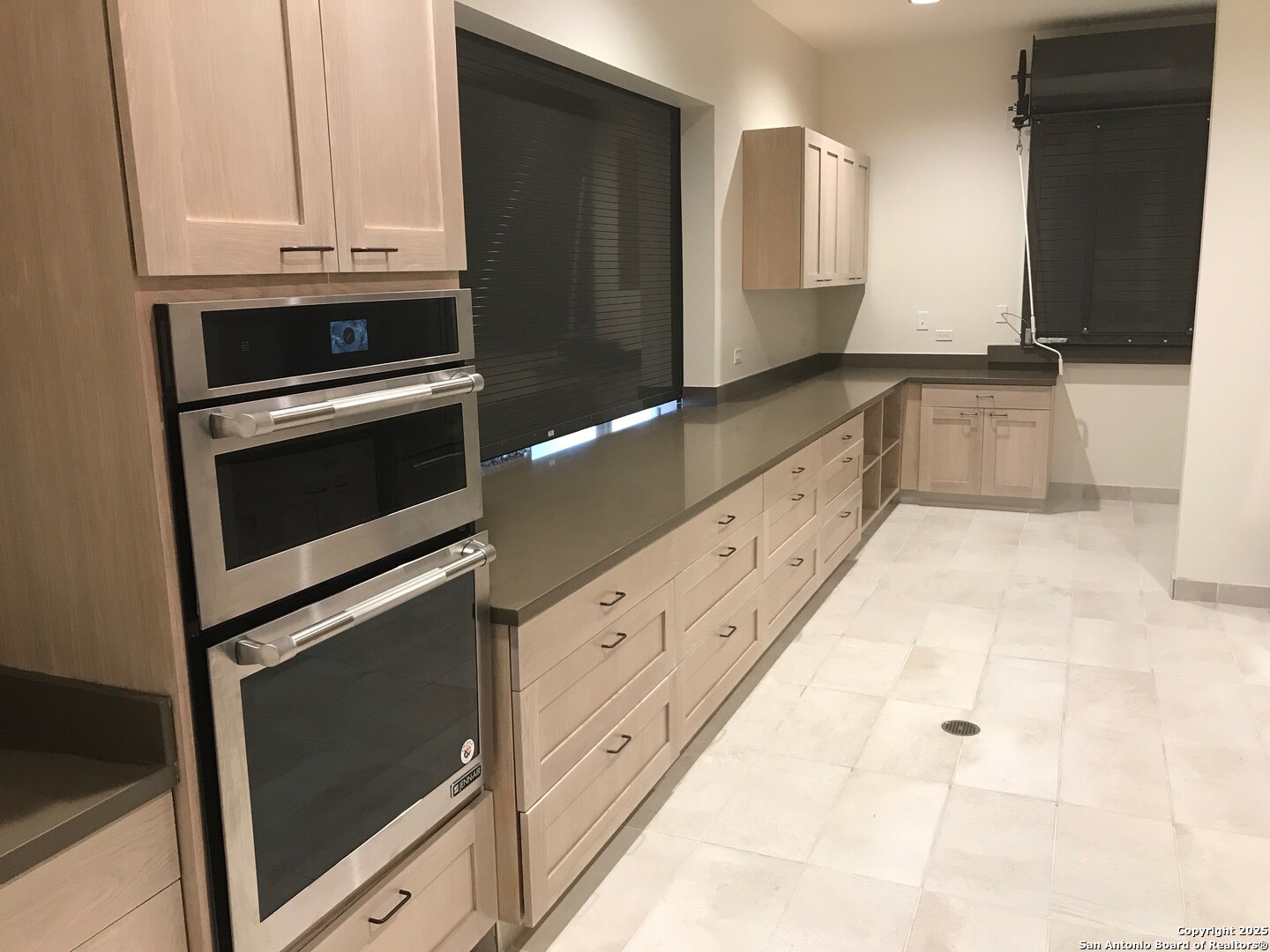 13322 Silky Rye San Antonio, TX 78254 - Photo 33 of 44 a kitchen with granite countertop white cabinets and stainless steel appliances