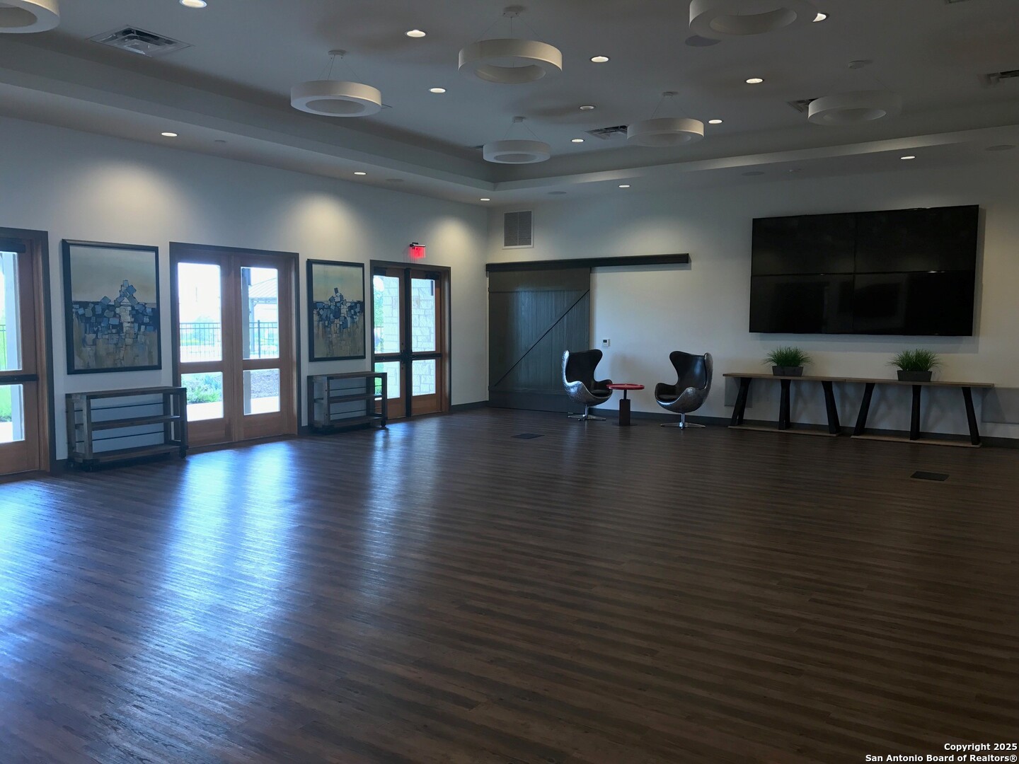 13322 Silky Rye San Antonio, TX 78254 - Photo 34 of 44 an empty room with wooden floor and windows