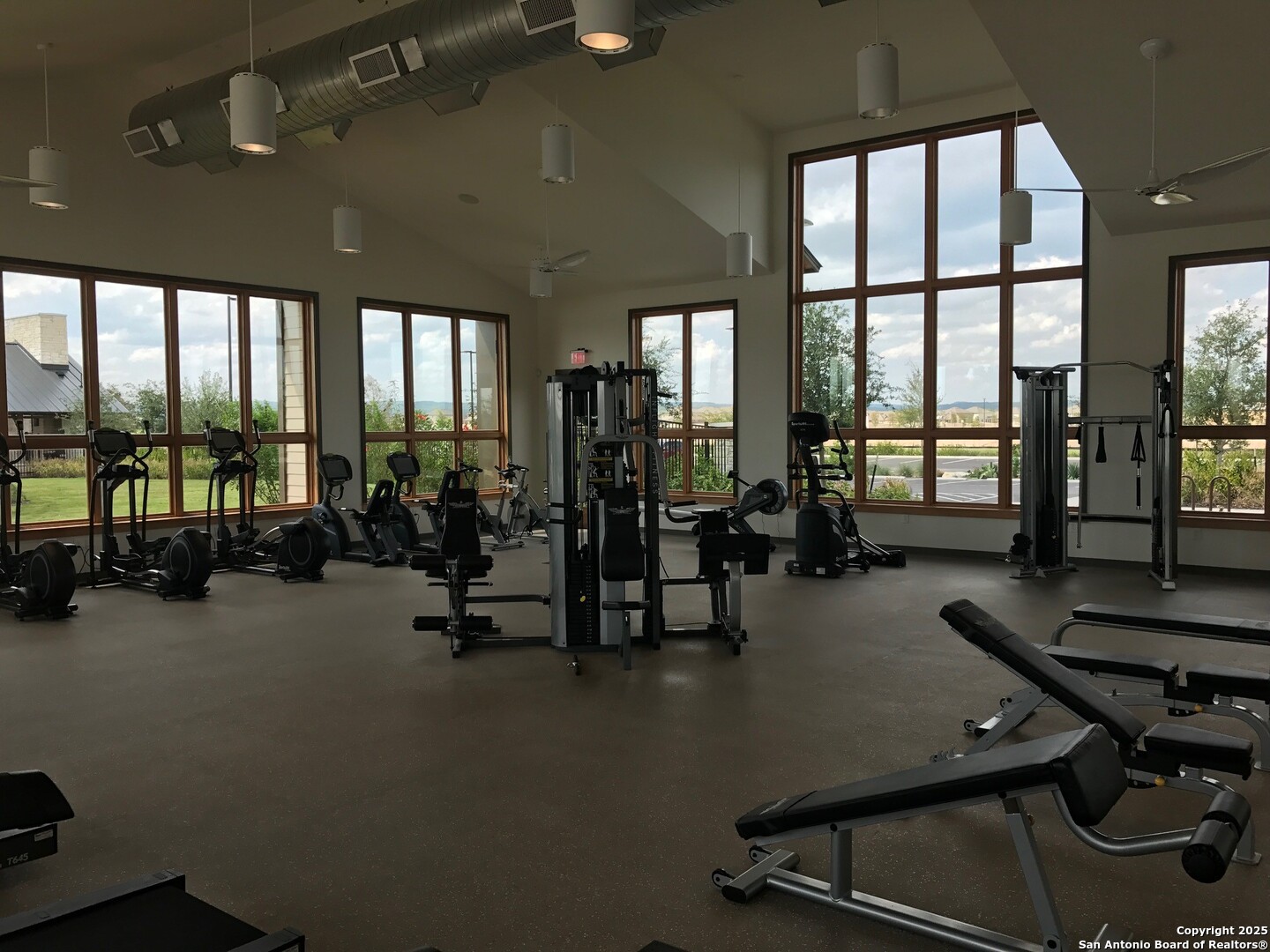 13322 Silky Rye San Antonio, TX 78254 - Photo 36 of 44 a room with gym equipment and large windows