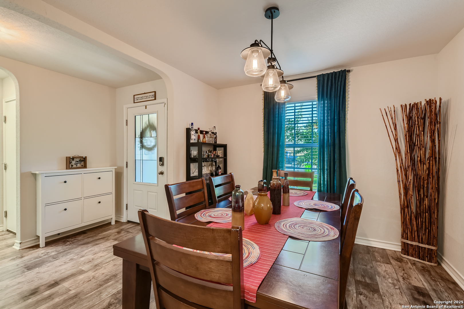 13322 Silky Rye San Antonio, TX 78254 - Photo 7 of 44 a view of a dining room with furniture window and wooden floor