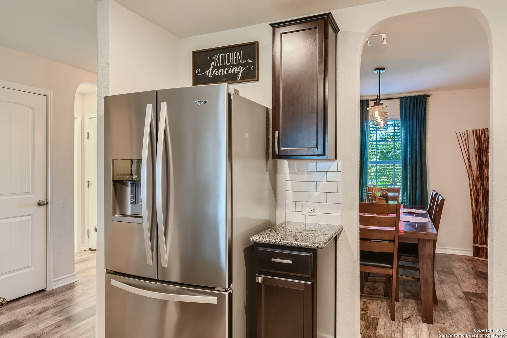 13322 Silky Rye San Antonio, TX 78254 - Photo 9 of 44 a metallic refrigerator freezer sitting in a kitchen