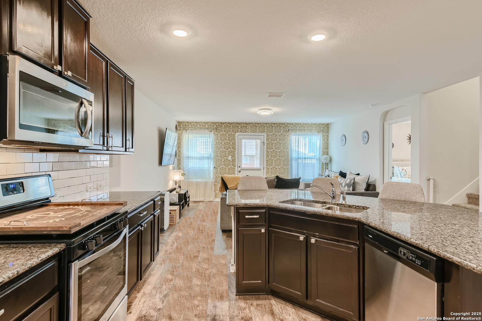 13322 Silky Rye San Antonio, TX 78254 - Photo 10 of 44 a kitchen with a sink stove and cabinets