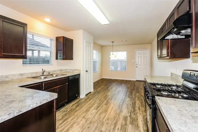 a kitchen with a stove and a sink