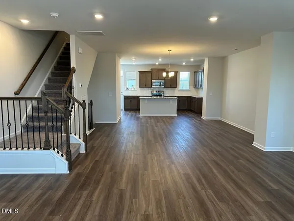 a kitchen with stainless steel appliances granite countertop a sink stove and microwave