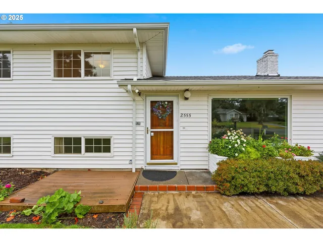 a front view of a house with garden