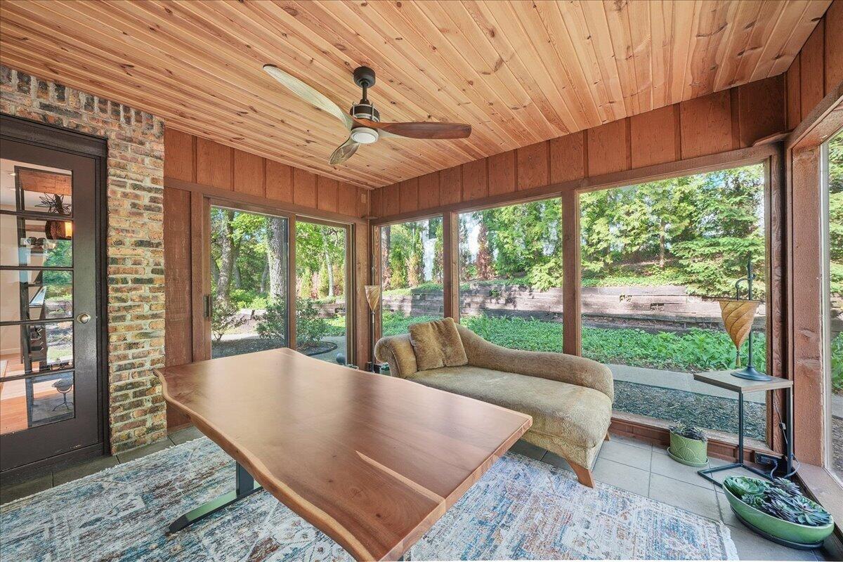 63 Ski Hill Road Portage, IN 46368 - Photo 5 of 28 a living room with furniture and a floor to ceiling window