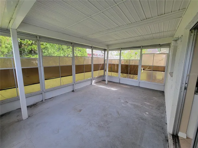 a view of an empty room with a sliding door