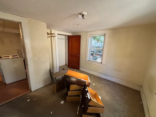 a room with window and wooden floor