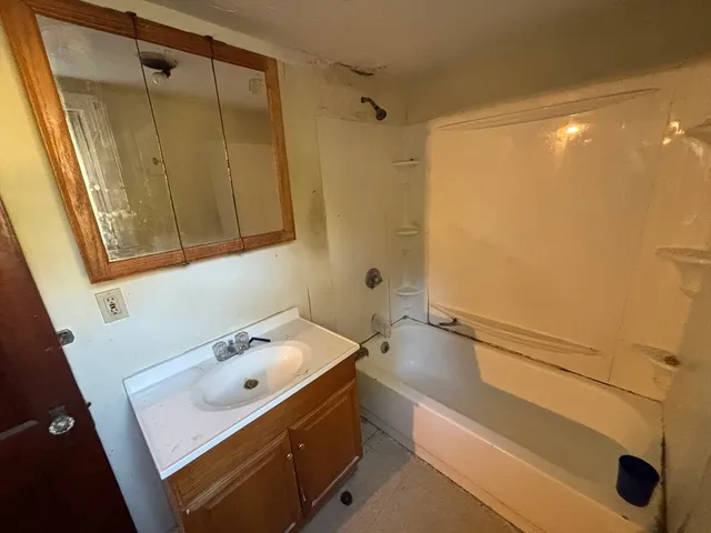 a bathroom with a sink and a tub