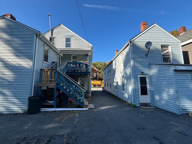 a view of a house with large windows