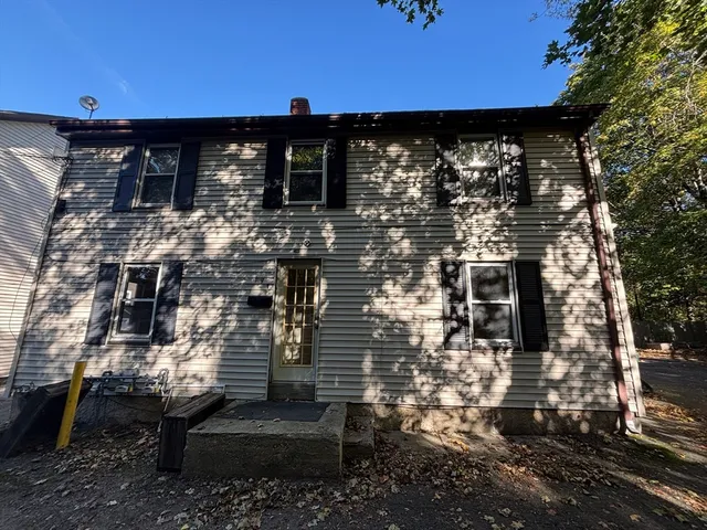 a view of a backyard of the house