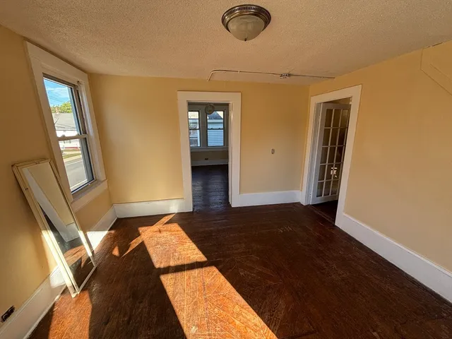 a view of an empty room and glass door