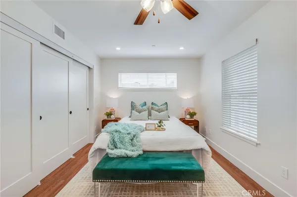 a bed room with a bed and a window