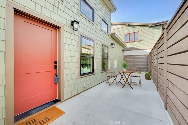 a view of two chairs in the balcony