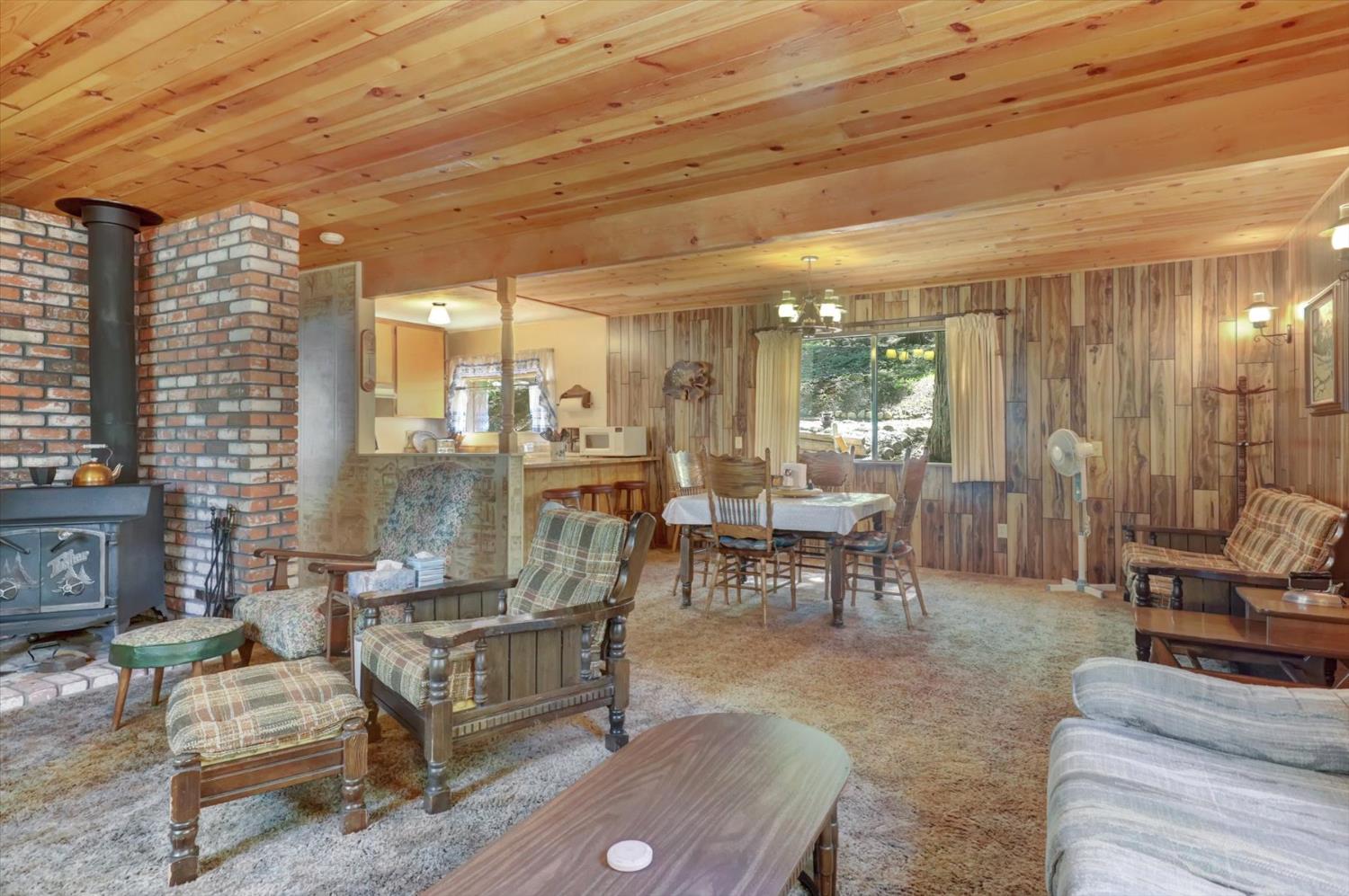 351 Silver Tip Springs Road Strawberry Valley, CA 95981 - Photo 13 of 57 a living room with furniture and a large window