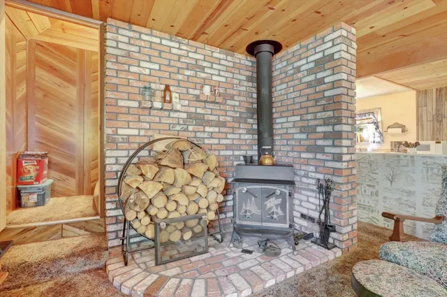 a spacious bedroom with a bed and a chandelier