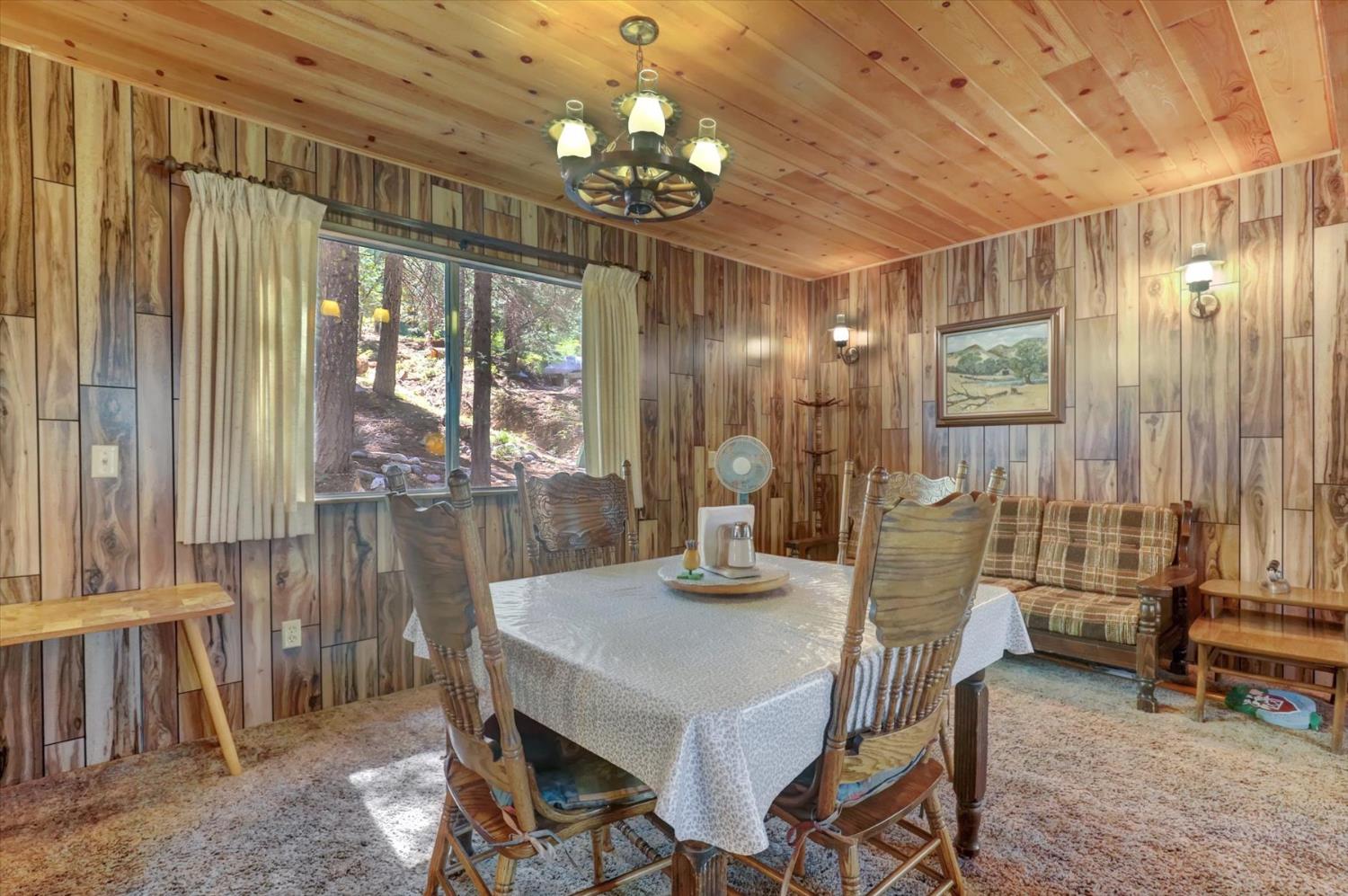 351 Silver Tip Springs Road Strawberry Valley, CA 95981 - Photo 4 of 57 a view of a dining room with furniture and chandelier