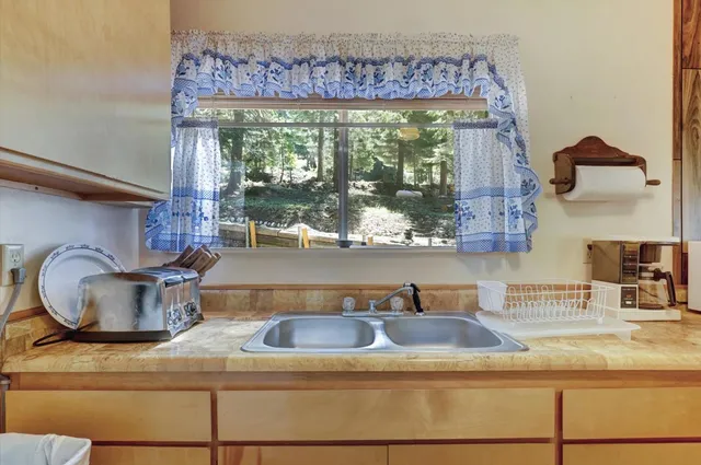 a bedroom with bed and a window