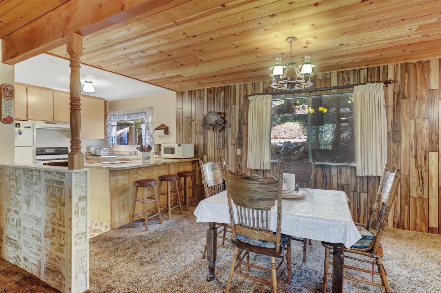 351 Silver Tip Springs Road Strawberry Valley, CA 95981 - Photo 10 of 57 a dining room with furniture and window
